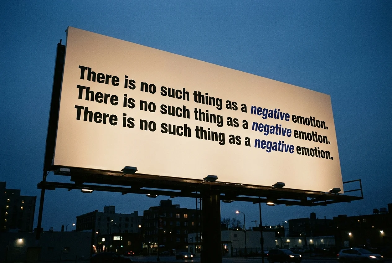 A Times Square billboard repeating three times: There is no such thing as a negative emotion.